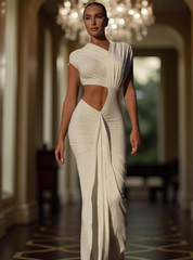 Ivory white draped cut-out gown highlighting waist, exuding elegant femininity and power. Perfect for standout evening events.